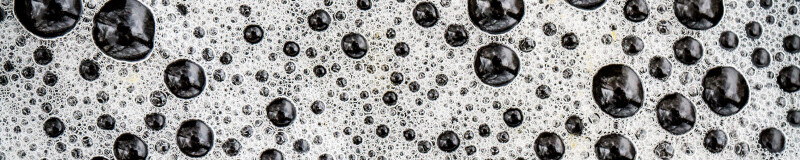 Macro photo bubbles in a dark liquid