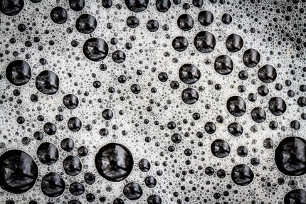 Macro photo bubbles in a dark liquid