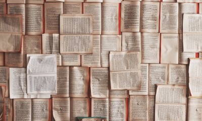 many books laying open over each other