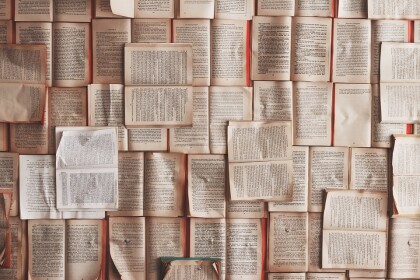 many books laying open over each other
