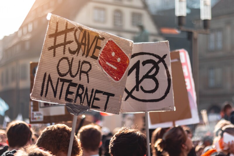 Sign saying "#Save Our Internet" at a protest