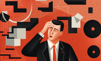 Man scratching his head trying to think