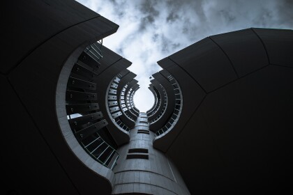 View from the base of a building looking up at the curves of the balconies