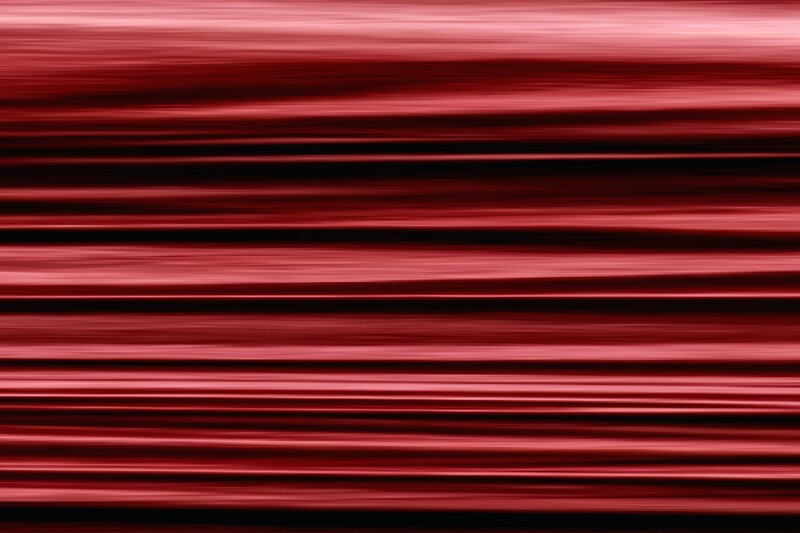 Abstract image showing blurred red and black lines