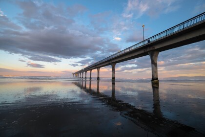 New Brighton pier at sunset, tide is out