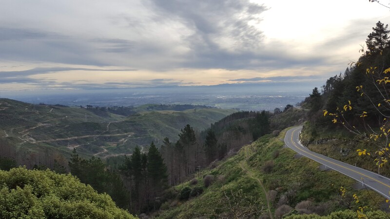 The view looking west over the Port Hills and Christchurch. Dyers Pass Road is to the right.