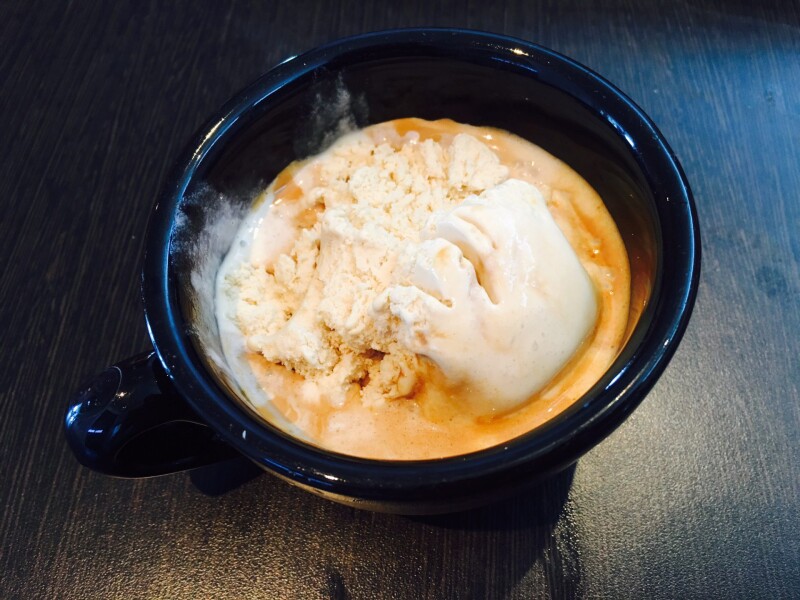 An affogato in a black cup