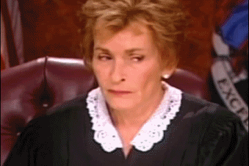 Gif of Judge Judy shaking her head and putting her head in her hand