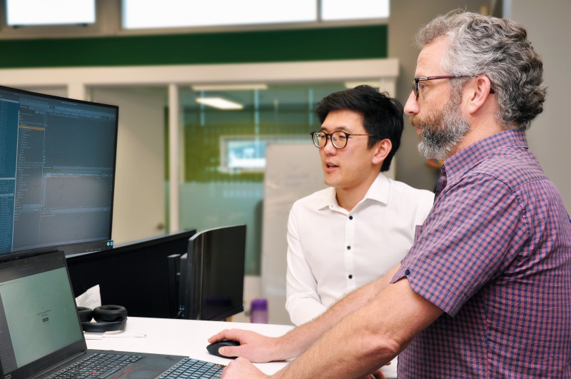 Max and Mark discussing some code on a computer screen