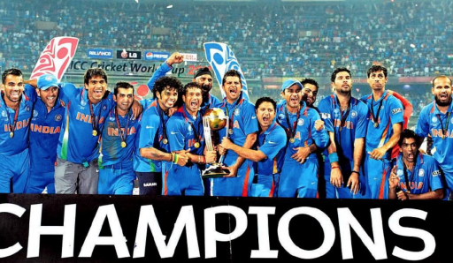 Picture of the Indian cricket team celebrating with their 2011 World Cup trophy, the word "CHAMPIONS" at the bottom of the image
