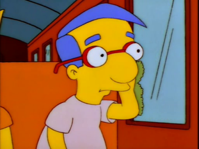 Milhouse looks sadly out the bus window