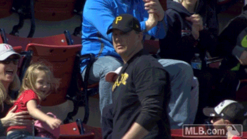 Gif of a man in the stands at a sports game taking a bow