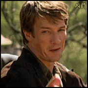 Gif of man looking down the camera doing a finger pistol and a wink